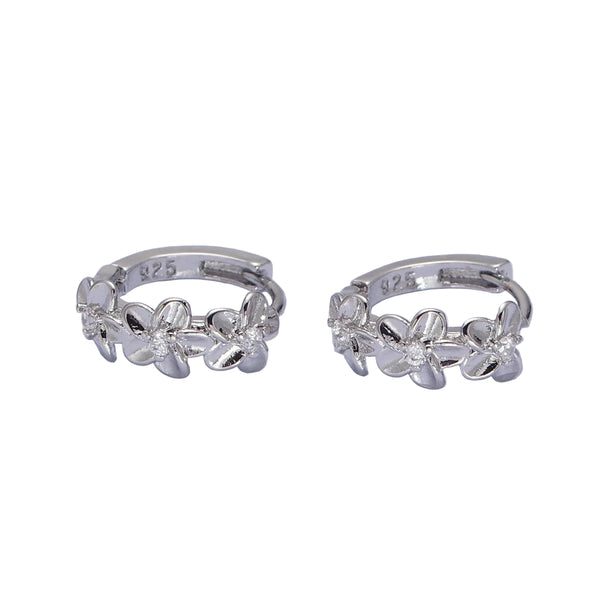 Pair of silver hoop earrings with floral designs on a light gray background